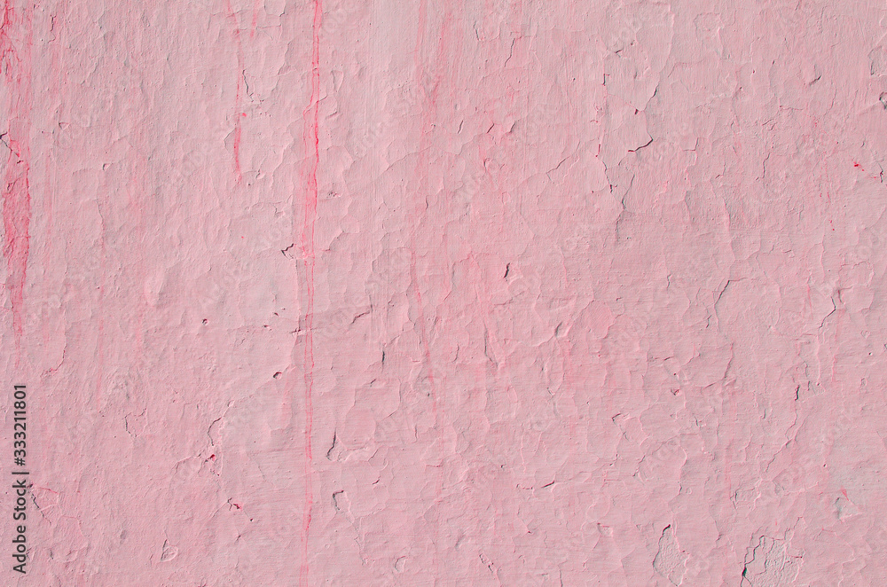 Fragment of old house wall close-up. Pink background. Peeling plaster on concrete surface. Cracks in paint. Copy space. Place for text. Selective focus image. Fragment of old house wall close-up. Pink background. Peeling plaster on concrete surface. Cracks in paint. Copy space. Place for text. Selective focus image.