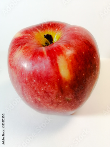 red, ripe, round Apple on a white background