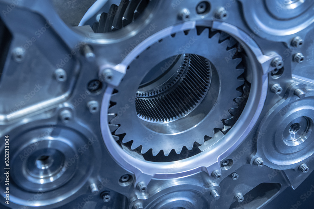Jet engine gear wheels, industrial background. Blue toned. Jet engine gear wheels, industrial background. Blue toned.