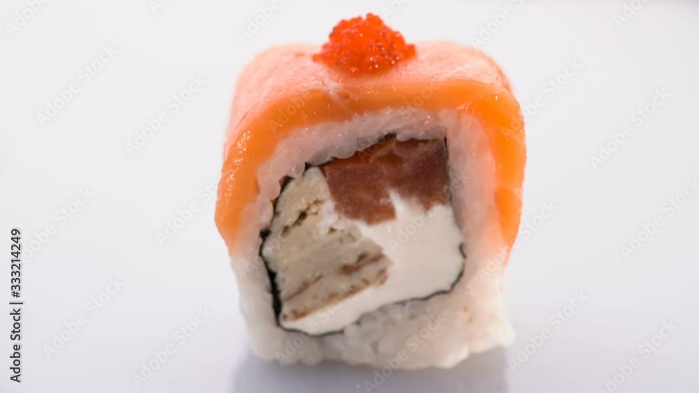 Syake fila maki roll raw salmon with cream cheese and avokado on white background Syake fila maki roll raw salmon with cream cheese and avokado on white background