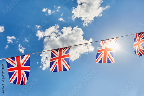 British Union Jack bunting flags against blue sky