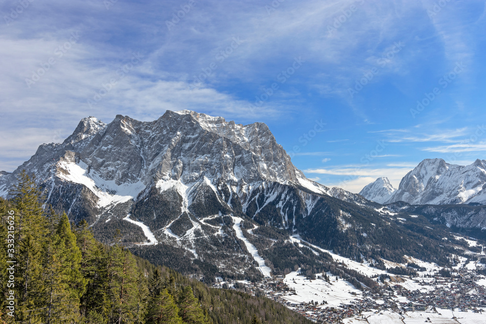 Zugspitze mountain and Ehrwald at sunny winter day. Tirol, Austria