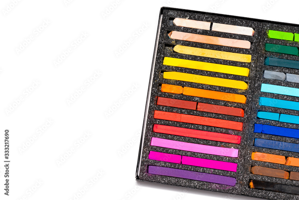 pastel crayons in a black box on a white background pastel crayons in a black box on a white background