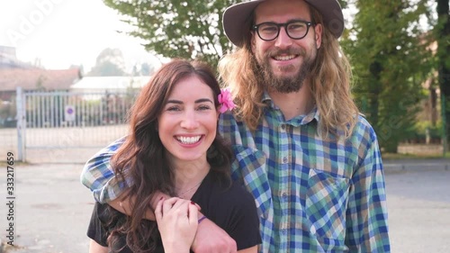 Young beautiful happy couple outdoor posing hugging - love, bonding, romance concept photo