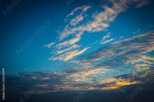 Sunrise In Winter. Clouds In The Sky Illuminated By The Rays Of The Rising Sun.