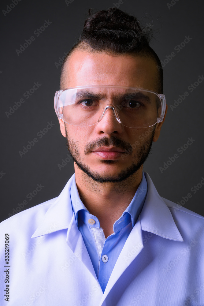 Face of handsome bearded Turkish man doctor as scientist Face of handsome bearded Turkish man doctor as scientist