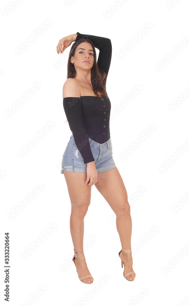 Beautiful happy young woman standing in shorts Beautiful happy young woman standing in shorts