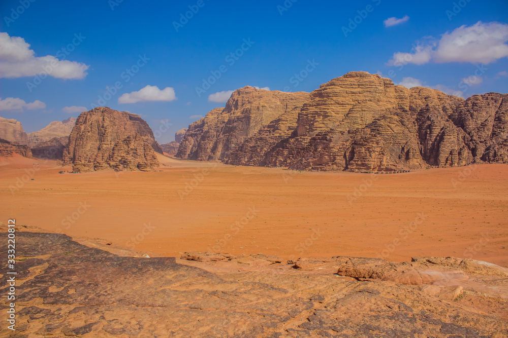 desert landscape top view point of rock sand valley and rocky mountain ridge vivid colorful Jordan Middle East region