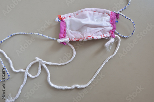 Принти на полотні Selfmade proctective face mask on a gray table