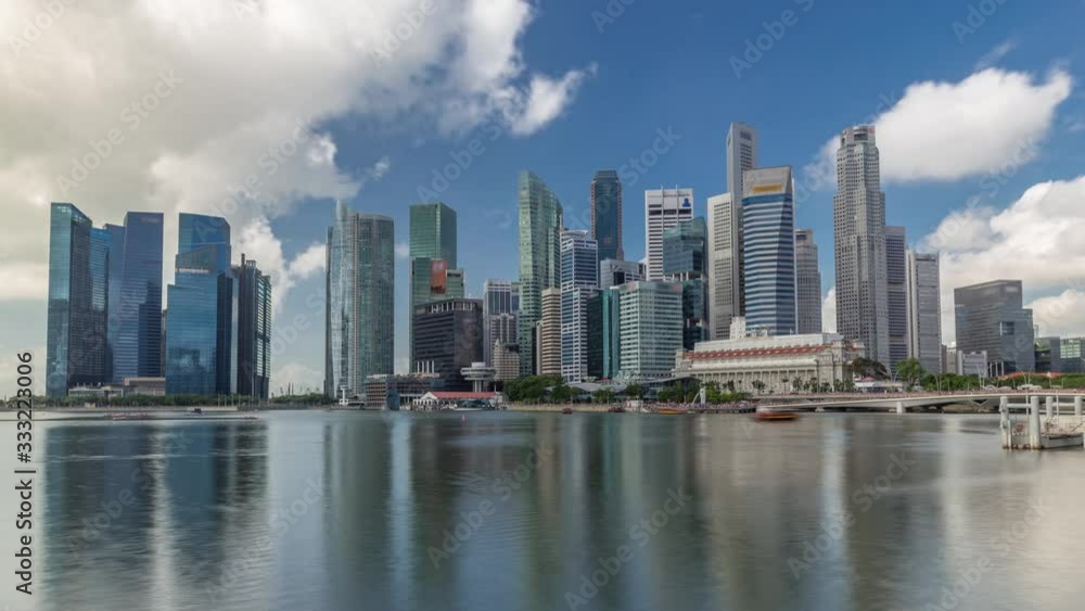 Business Financial Downtown City and Skyscrapers Tower Building at Marina Bay timelapse hyperlapse, Singapore, Cityscape Urban Landmark and Business Finance District Center reflected in water Business Financial Downtown City and Skyscrapers Tower Building at Marina Bay timelapse hyperlapse, Singapore, Cityscape Urban Landmark and Business Finance District Center reflected in water