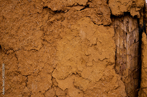 Old clay shack, wall with clay stucco. Texture, old stucco, vintage, clay wall.