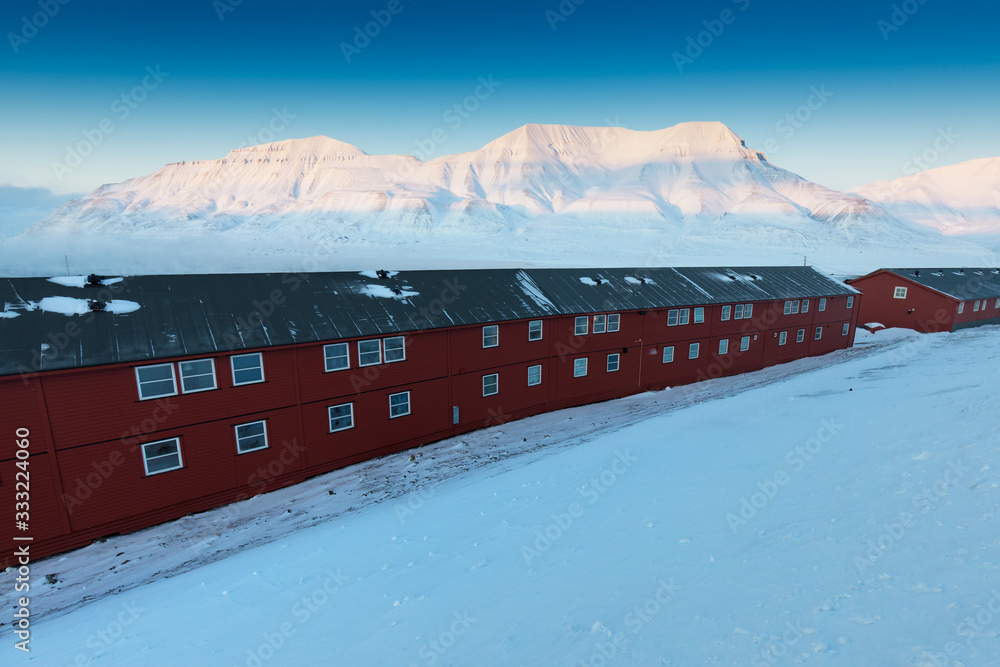 Naklejka premium Colourful houses in Longyearbyen, Svalbard, the most northerly town in the world. Svalbard is a Norwegian archipelago between mainland Norway and the North Pole. Winter time in Arctica 