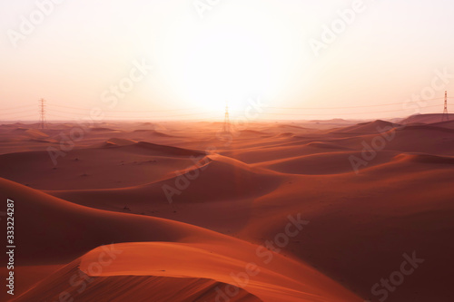 Sand dunes of the Arabian desert in Riyadh, Saudi Arabia at sunrise. New life beginnings, hope and brighter tomorrow concept. 