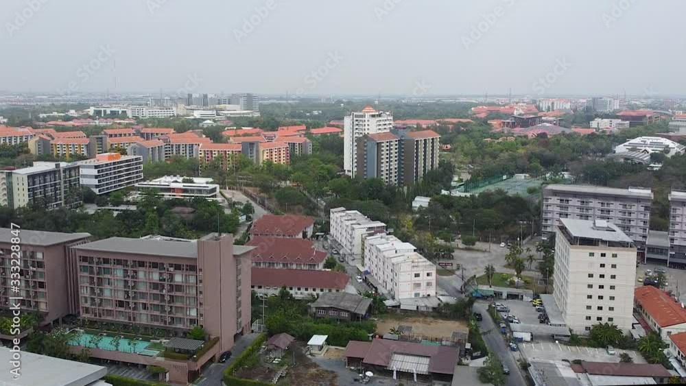 Scenic View Of Residential Buildings And Green Trees In Lopburi, Thailand Under The Dramatic Sky - Aerial Shot Scenic View Of Residential Buildings And Green Trees In Lopburi, Thailand Under The Dramatic Sky - Aerial Shot