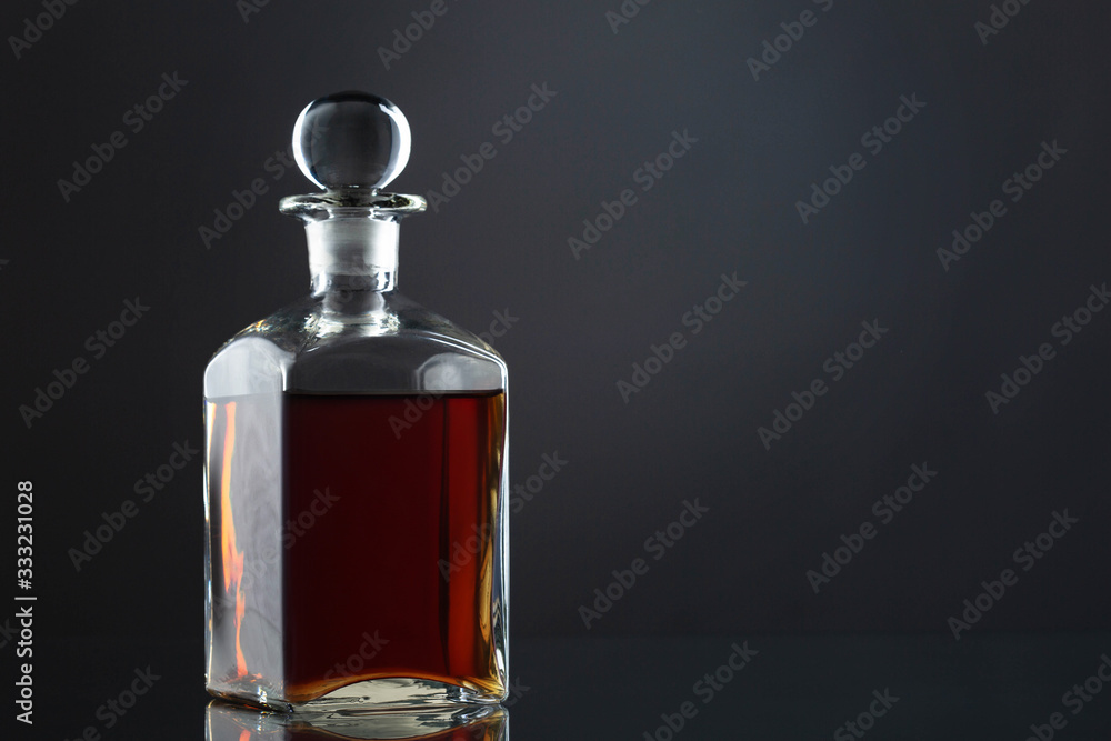 Bottle of whisky on gray Bottle of whisky on gray