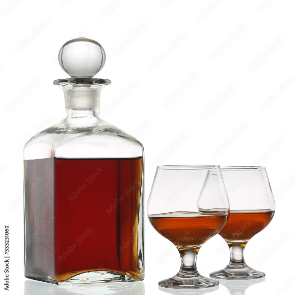 Bottle of whisky and two glases isolated on white