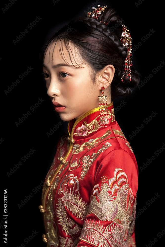 Asian girls wearing ancient clothes on black background