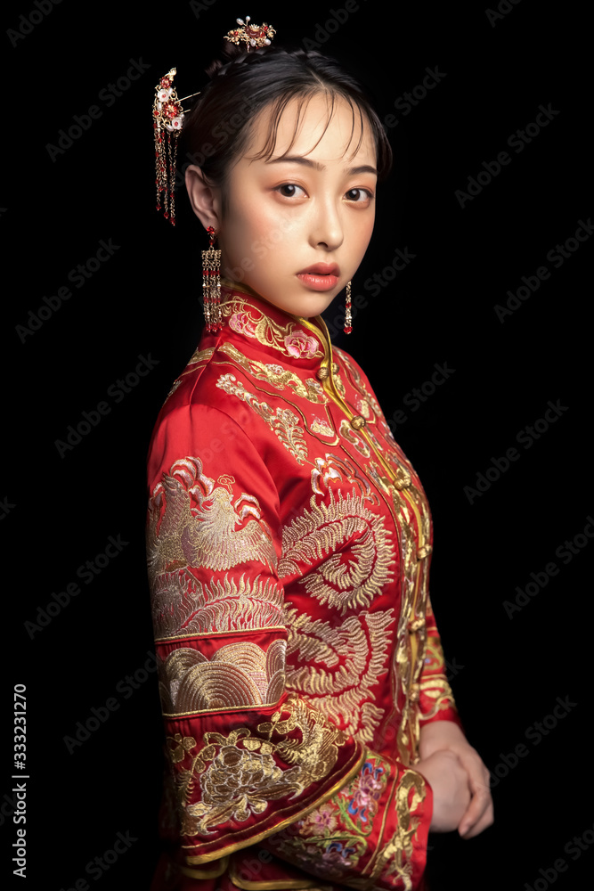 Asian girls wearing ancient clothes on black background Asian girls wearing ancient clothes on black background