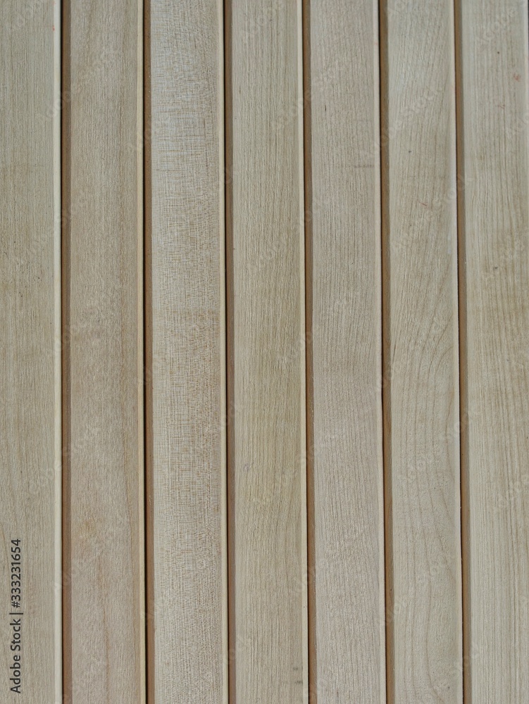 Background from wooden boards, beige color. Wood texture. Planks are vertical. For the text. Background from wooden boards, beige color. Wood texture. Planks are vertical. For the text.