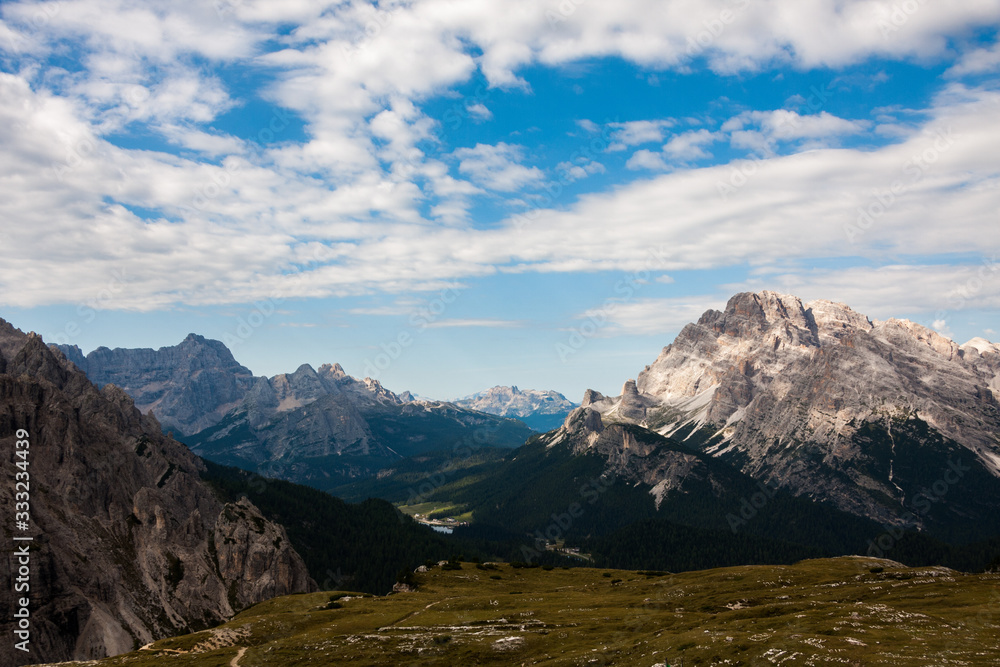 Panorama of Dolomites mountains with clouds. National Park Tre Cime di Lavaredo, Alps mountain chain, Trentino Alto Adige region, Sudtirol, Italy