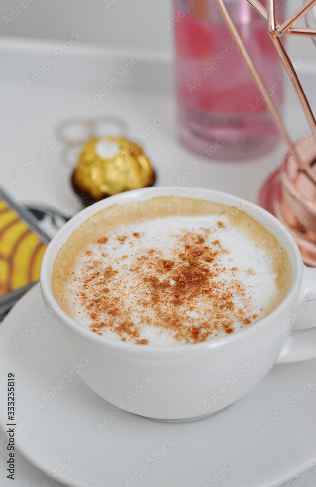 cup of coffee with cream and cinnamon cup of coffee with cream and cinnamon