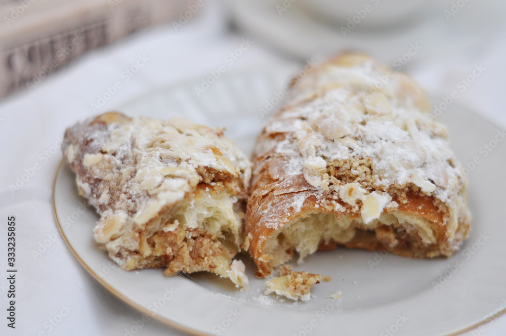 tasty fresh almond croissants on the plate