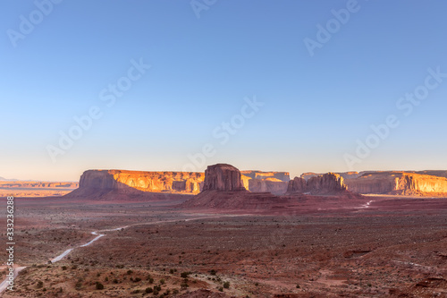 Beautiful panoramic sunset view over famous Buttes of Monument Valley on the border between Arizona and Utah, USA