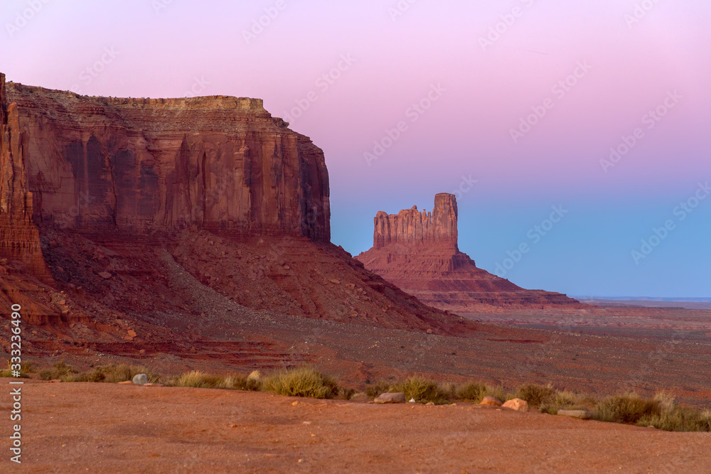 Beautiful sunset over famous view of Monument Valley on the border between Arizona and Utah, USA