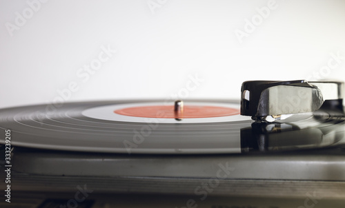 Close up of vinyl record player on a white background. Shallow depth of field, focus select.
