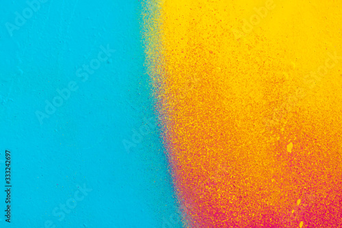 Beautiful bright colorful street art graffiti background. Abstract creative spray drawing fashion colors on the walls of the city. Urban Culture, yellow ,green , sunny, salad , light texture