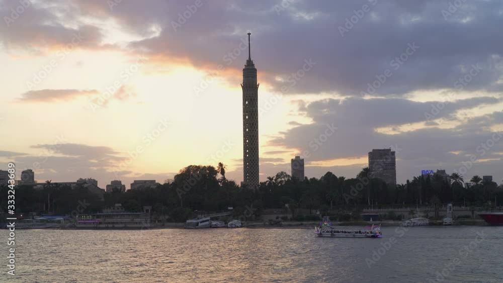 Dramatic silhouette sunset in Cairo, Egypt. Cairo tower and river Nile. Porplr cloudy sky. Dramatic silhouette sunset in Cairo, Egypt. Cairo tower and river Nile. Porplr cloudy sky.