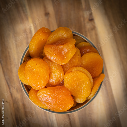 Dried fruit composition on wood background