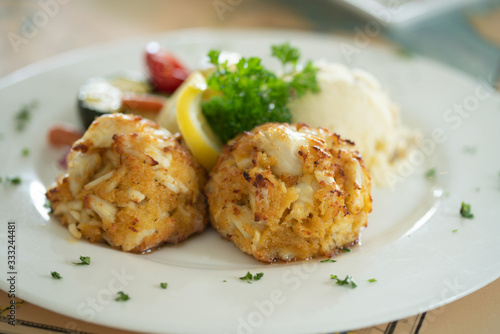 Crabcake dinner on plate in restaurant