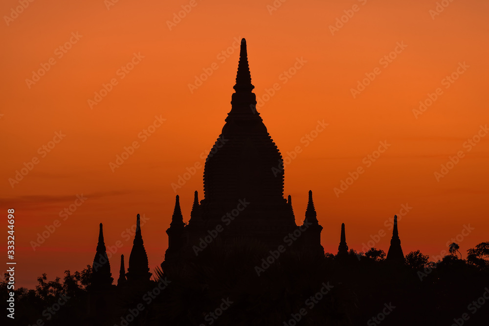 Sunset over temple in Bagan, Myanmar. Bagan is an ancient city and a UNESCO World Heritage Site. The remains of 3822 temples and pagodas still survive to the present days