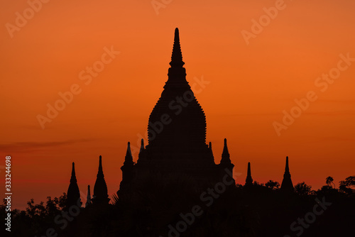 Sunset over temple in Bagan  Myanmar. Bagan is an ancient city and a UNESCO World Heritage Site. The remains of 3822 temples and pagodas still survive to the present days