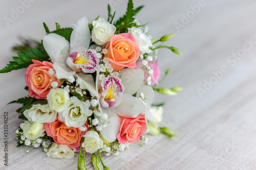 bouquet of fresh flowers from roses, orchids and white eustoma