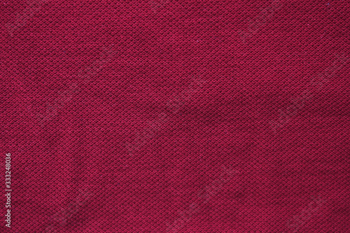 Burgundy colour fabric texture, empty vivid dark red or purple color background. Blank cotton cloth texture, burgundy shade of purple color wallpaper with copy space for graphic design and advertising