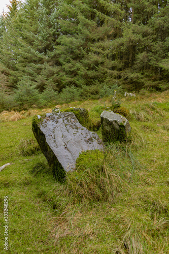 Double Horned Cairn Chambered Grave stones in Ballypatrick forest, Ballycastle, Causeway coast and glens, County Antrim, Northern Ireland photo
