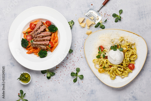 two plates with pasta