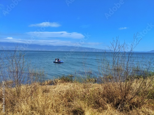 Fishing on the lake in inflatable boat