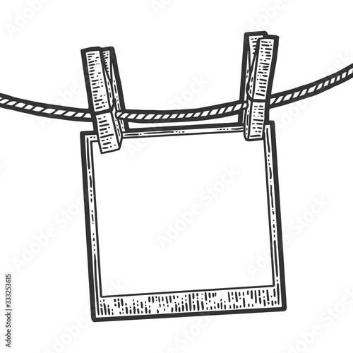 Sketch photo dries on a clothesline. Apparel print design. Scratch board imitation. Black and white hand image.