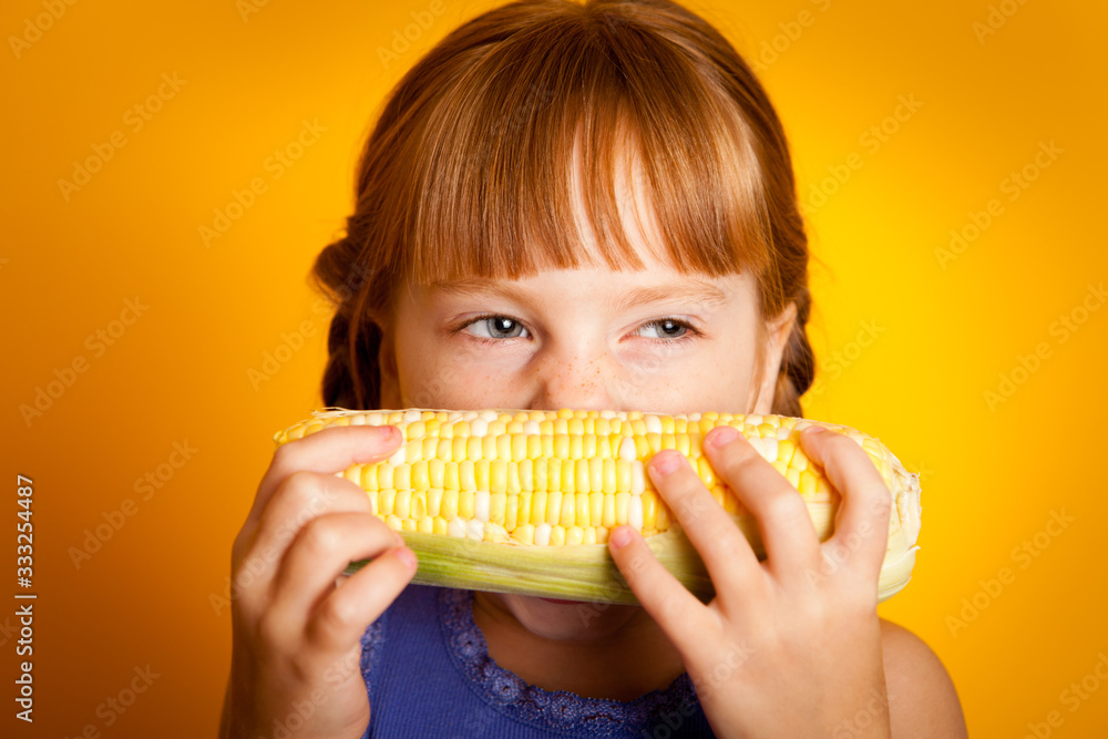 Little Girl Eating Corn on the Cob, Healthy Eating, Food, Nutrition Little Girl Eating Corn on the Cob, Healthy Eating, Food, Nutrition