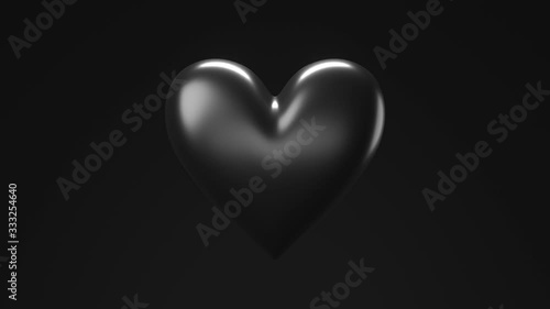 Black broken heart objects in black background. Heart shape object shattered into pieces.