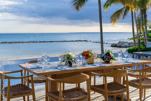 Fototapeta Naklejka Na Ścianę i Meble -  sunset beach front wedding table setting