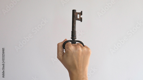 Corkscrew for opening bottles in the form of a key in a woman's fist. 