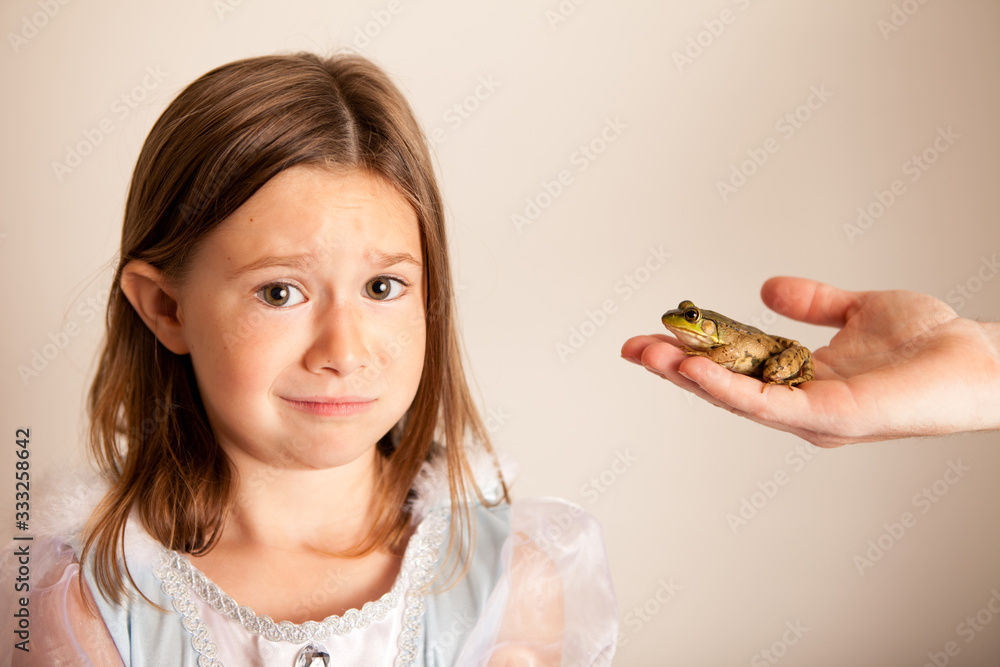 Princess Girl Hesitant to Kiss a Frog, Fairy Tale Magic Princess Girl Hesitant to Kiss a Frog, Fairy Tale Magic