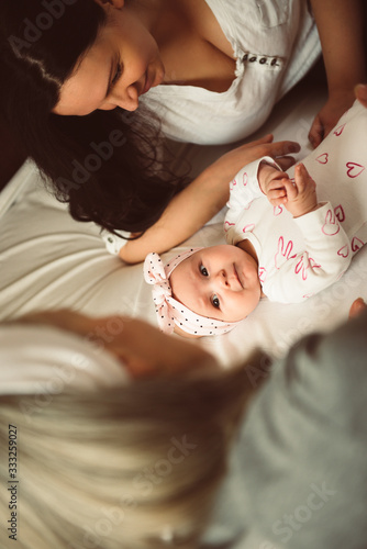 Cute baby girl looking at her grandmother