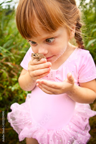 Silly Princess Girl Holding a Toad Outside, Fairy Tale Magic