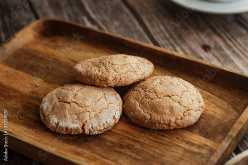 Almond cookies on the wood table. Romantic composition