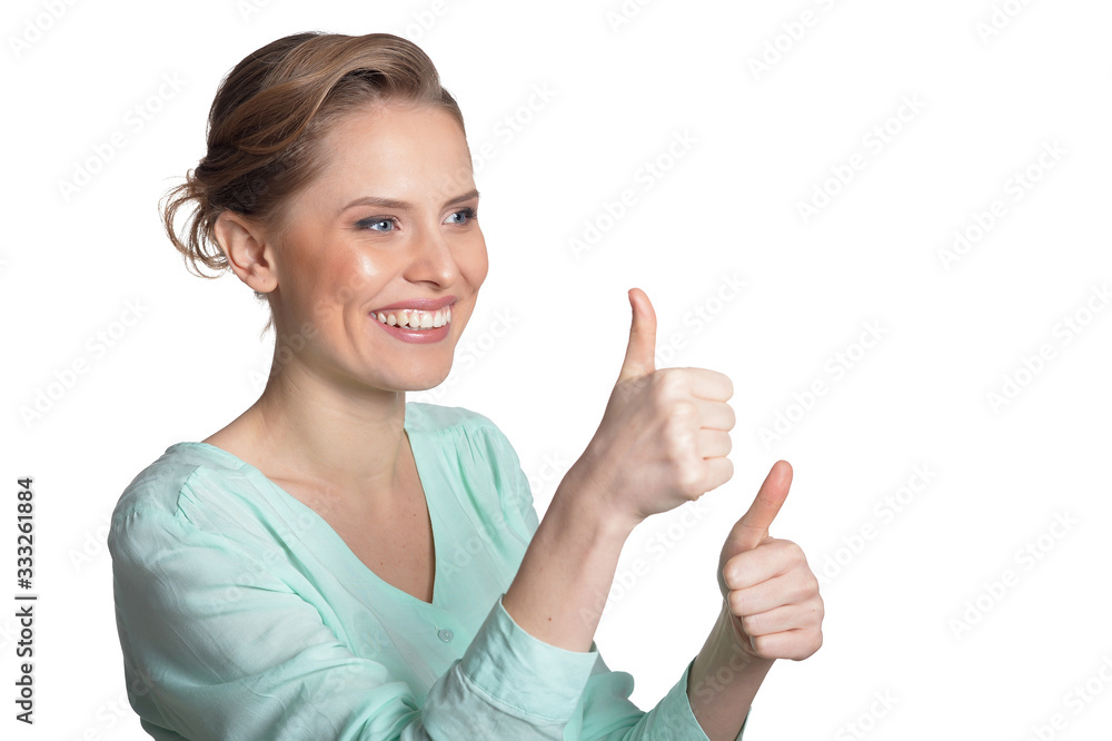 Portrait of beautiful young woman with thumbs up Portrait of beautiful young woman with thumbs up